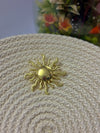 Sun brooch